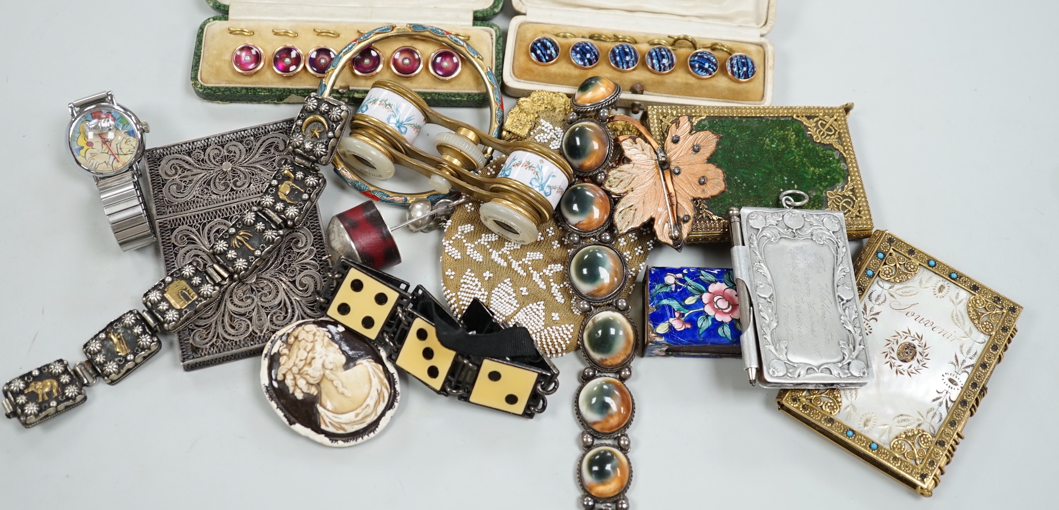 An interesting group of silver, yellow and white metal jewellery including a two colour bangle, identity bracelet, labradorite set bracelet, Austro Hungarian and amber dress ring, filigree card case, 9ct and enamel game